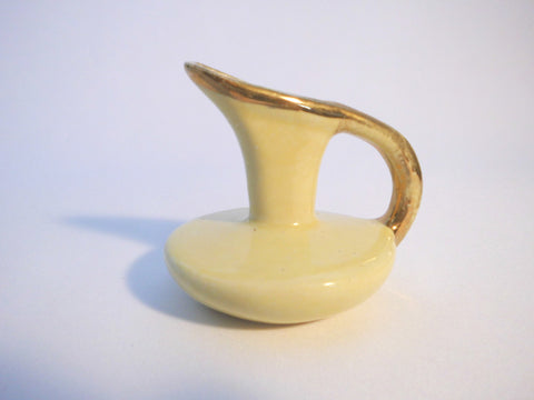 Small Yellow Pitcher with a Gold lining on handle,  7,7 cm  3" tall.   Southern Pottery 1955, Erwin Tennessee USA.