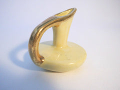 Small Yellow Pitcher with a Gold lining on handle,  7,7 cm  3" tall.   Southern Pottery 1955, Erwin Tennessee USA.