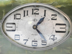 Exceptional French Art Deco marble 8-days Clock with green Onyx and Bronze Bas Relief plaques of Seagulls. 1920s. Currently fitted with a quartz movement.