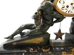 Impressive Clock in green patinated Spelter on a Portoro Marble Base. Designed by the famous Belgian Sculptor Georges Van de Voorde. This Masterpiece named "L'Etoile" (Star) was presented at the select "Salon des Artistes Français" in Paris around 1920.