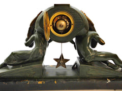 Impressive Clock in green patinated Spelter on a Portoro Marble Base. Designed by the famous Belgian Sculptor Georges Van de Voorde. This Masterpiece named "L'Etoile" (Star) was presented at the select "Salon des Artistes Français" in Paris around 1920.